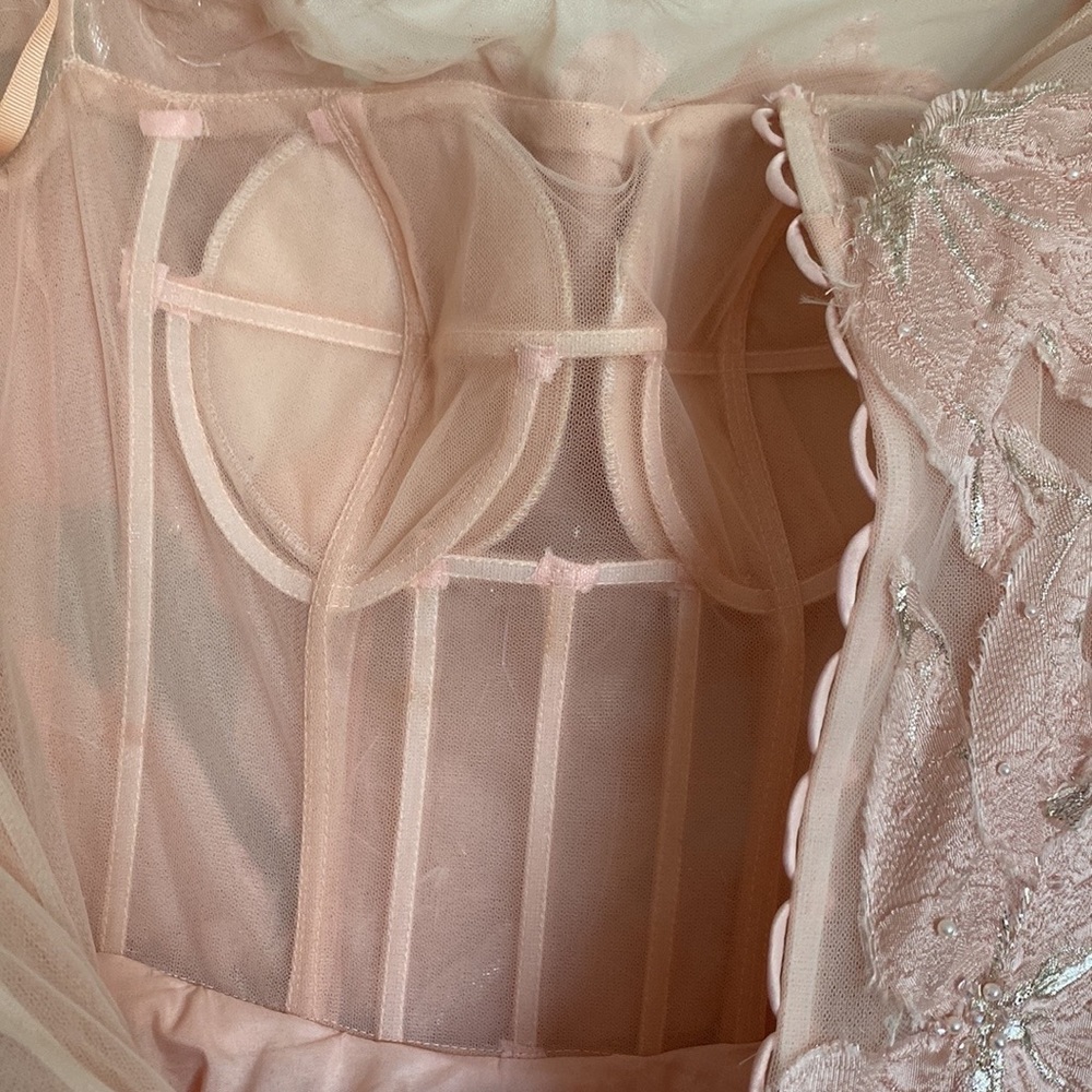 Fancy light nude gown with pearl and crystal in the upper part and the sleeves